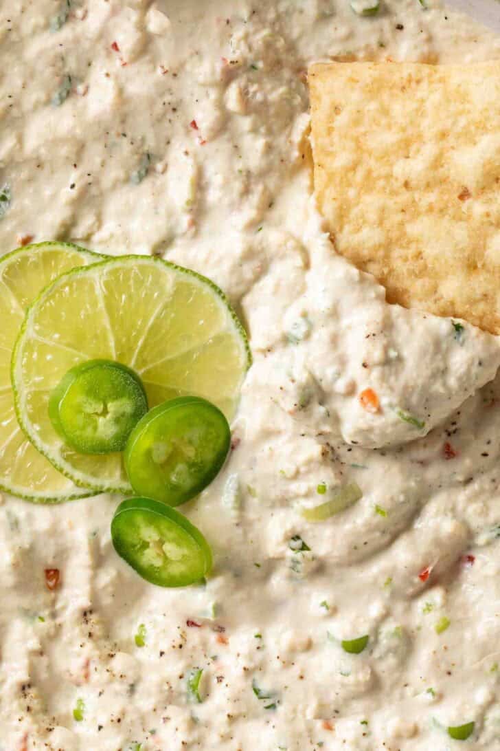 Tuna Fish Dip Recipe Tuna Fish Dip in a bowl with a tortilla chip.