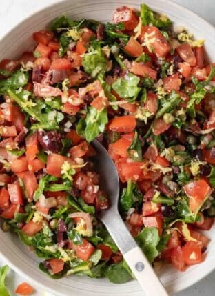 Italian Salsa in a white bowl with a spoon