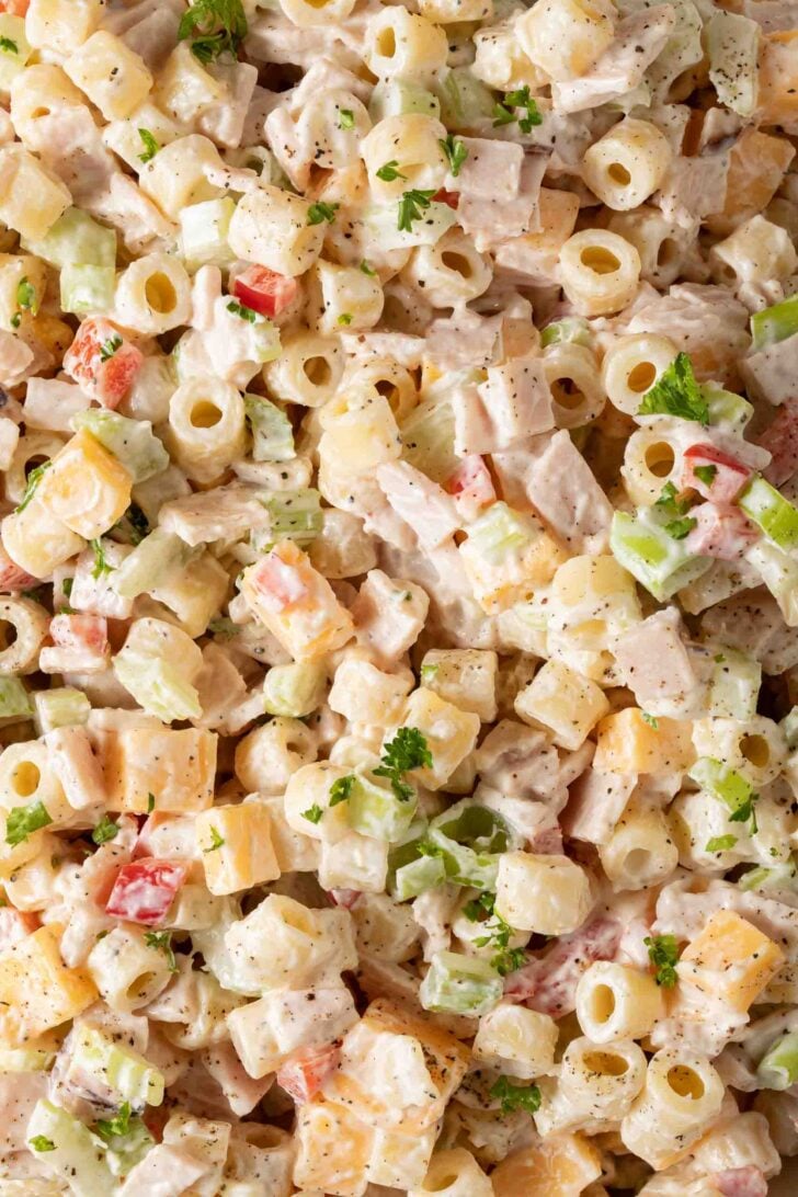 How to Make Macaroni Salad Creamy Macaroni Salad with cheese in a bowl.