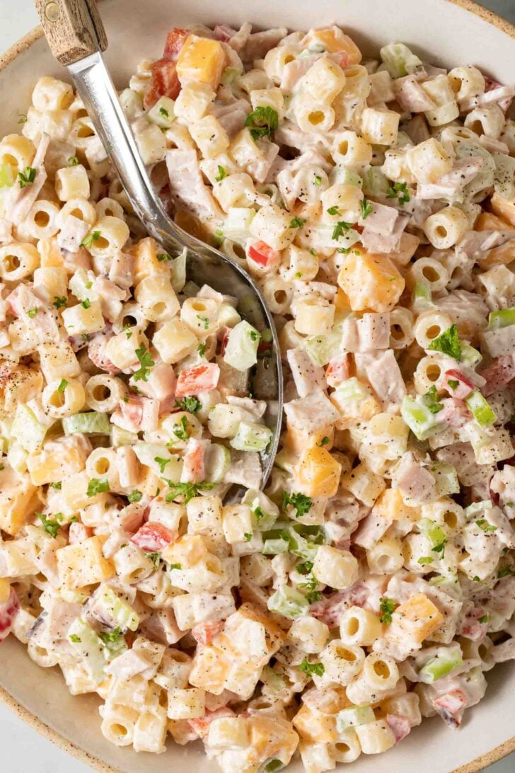 Ditalini Pasta Salad Ditalini Pasta Salad in a bowl with a serving spoon.