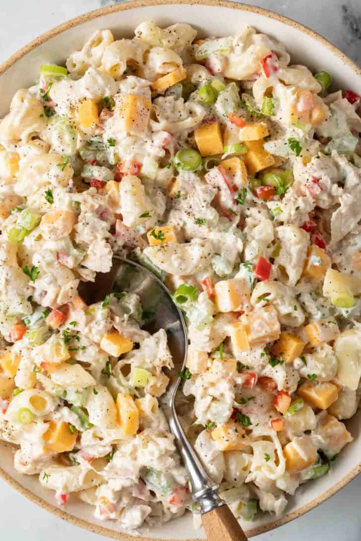 Macaroni Tuna Salad Macaroni Tuna Salad in a bowl with a spoon.