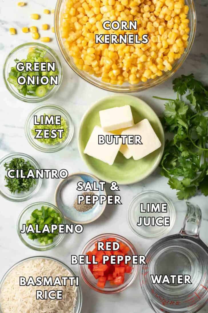 Corn Rice Recipe Glass bowls filled with corn kernels, gree onion, butter, lime juice and basmati rice for a Corn Rice recipe.