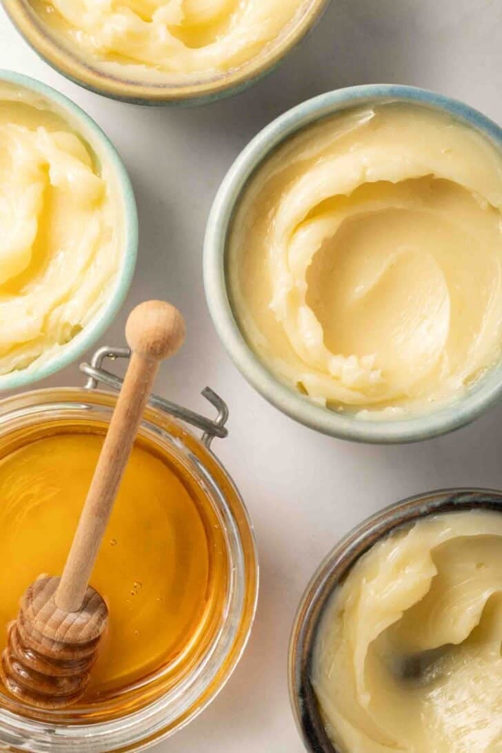 Homemade Honey Butter Homemade honey butter in four small jars.