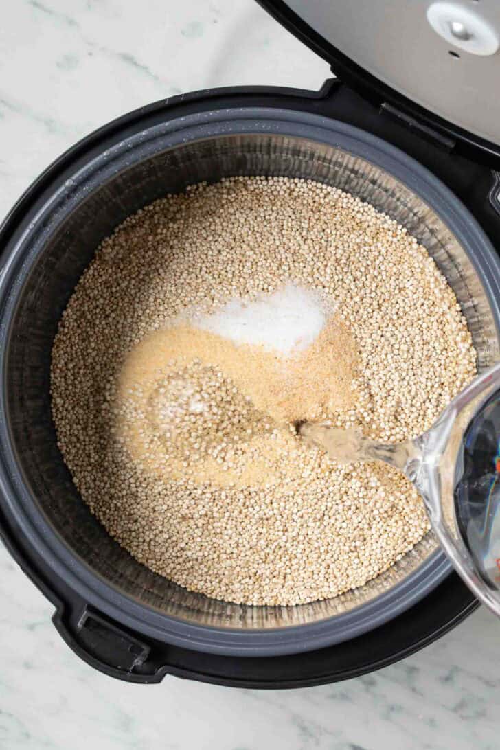 How to Make Quinoa in a Rice Cooker Quinoa, seasonings and water in a rice cooker for how to make quinoa in a rice cooker recipe.