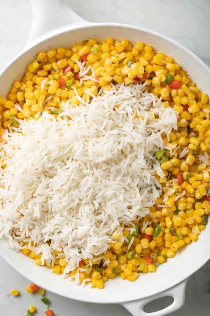 Rice and Corn Rice and corn in a white skillet.