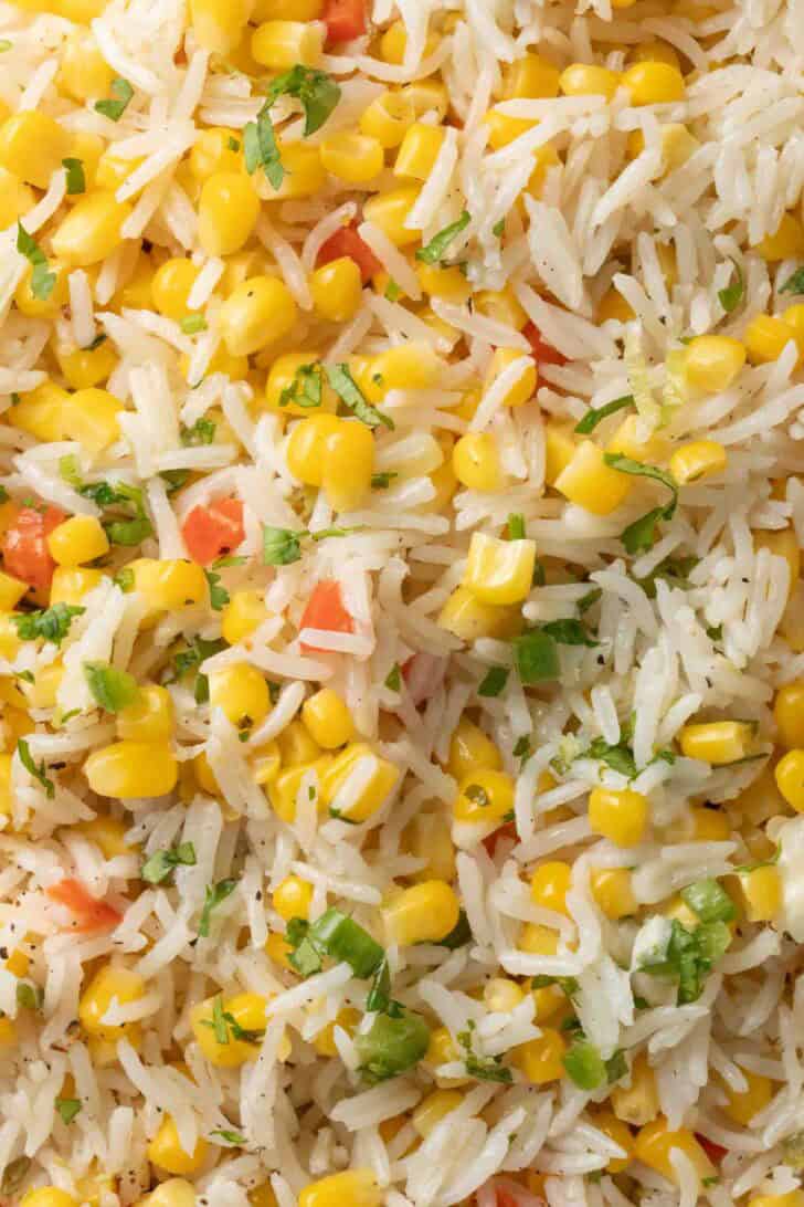 Rice with Corn Rice with Corn tossed in a skillet.