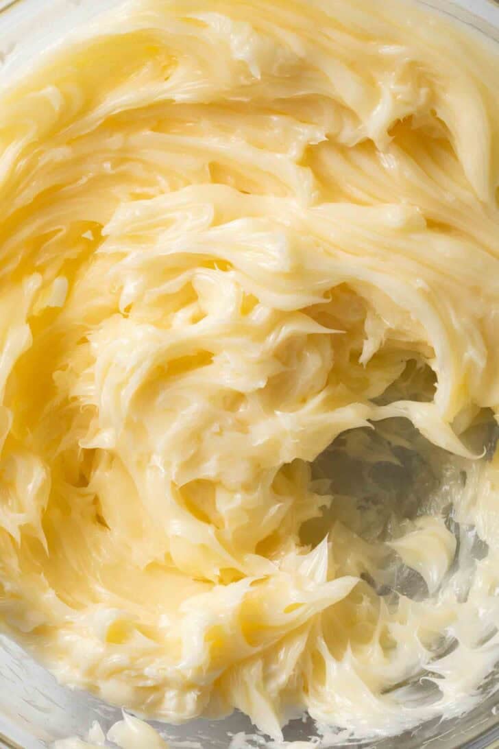 Whipped Honey Butter Whipped honey butter in a clear glass mixing bowl.