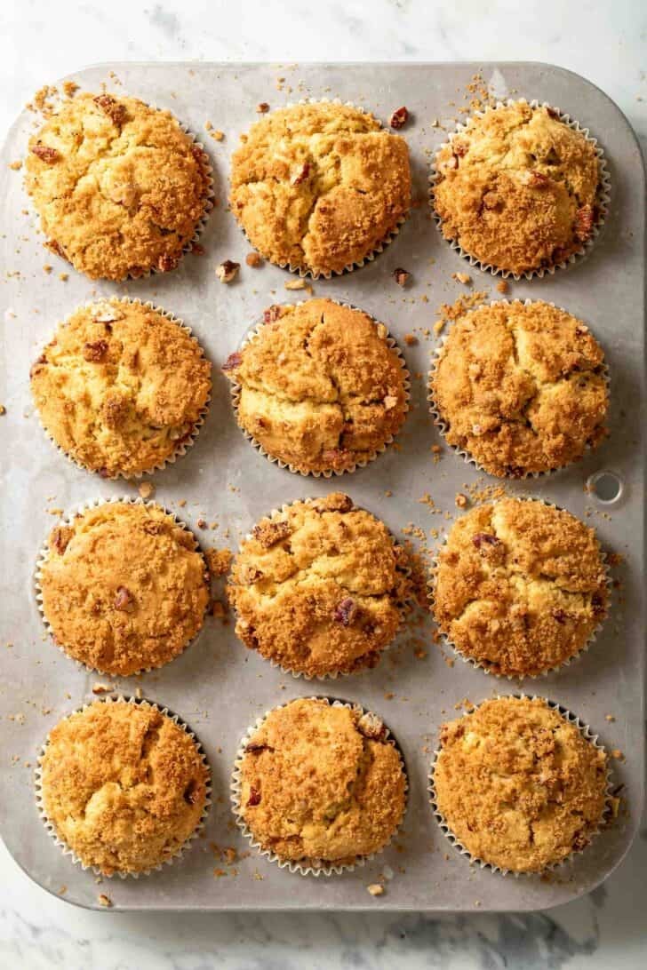 Pumpkin and Cream Cheese Muffins Pumpkin and Cream Cheese Muffins in a muffin tin.