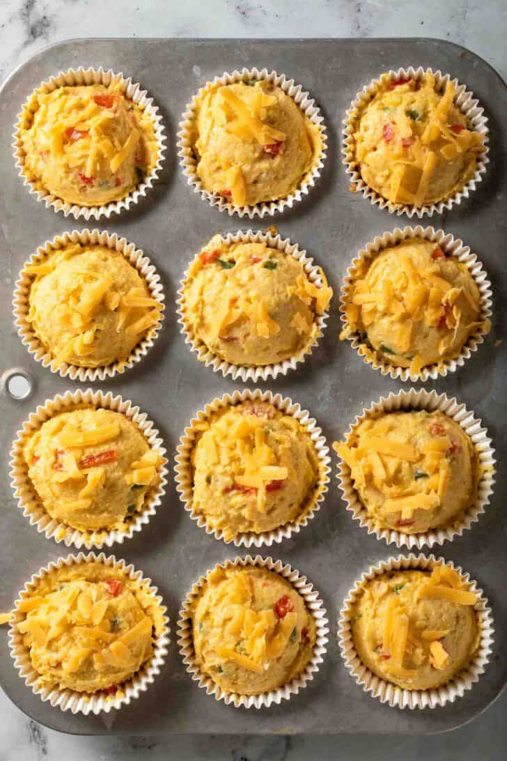 Jalapeno Cheddar Cornbread Muffins Jalapeno Cheddar Cornbread Muffins batter in muffin tins.