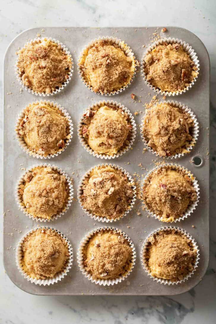 Cream Cheese Pumpkin Muffins Cream Cheese Pumpkin Muffins batter in a muffin tin.
