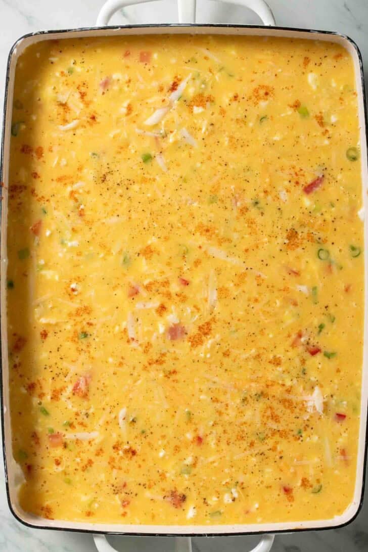 Egg Bake With Cottage Cheese Whisked eggs in a white baking dish for Egg bake with Cottage Cheese.