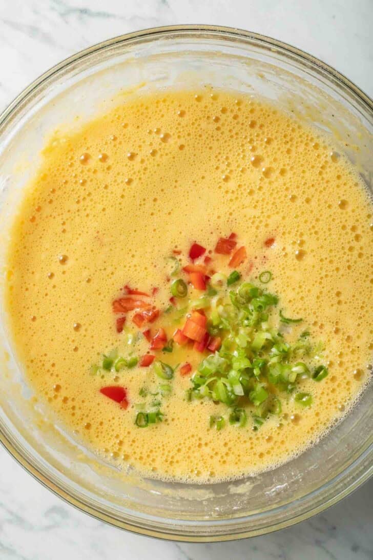Cottage Cheese Egg Bake Recipe Whisked eggs in a clear glass mixing bowl.