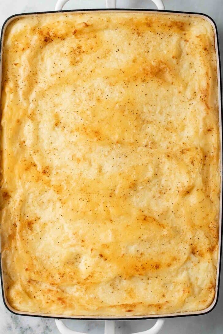 Baked Mashed Potatoes Baked Mashed Potatoes in a white baking dish.