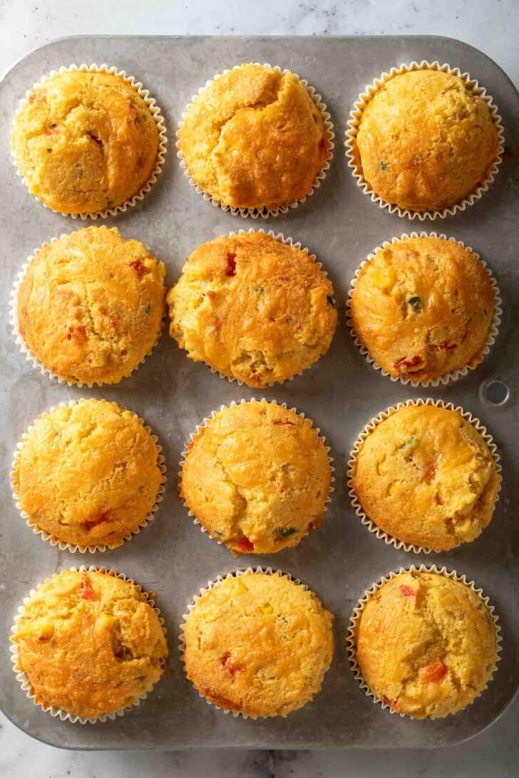 Jalapeno Cornbread Muffins Baked Jalapeno Cornbread muffins in a muffin tin.
