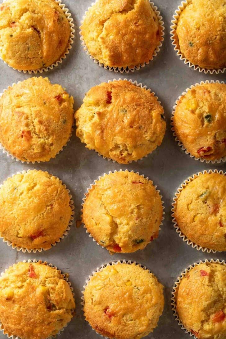 Jalapeno Cheddar Cornbread Muffins Baked Jalapeno Cheddar Cornbread Muffins in a muffin tin.