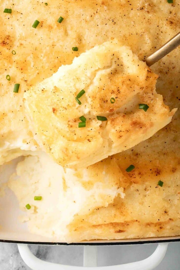 Make Ahead Mashed Potatoes Make Ahead Mashed Potatoes in a white baking dish.