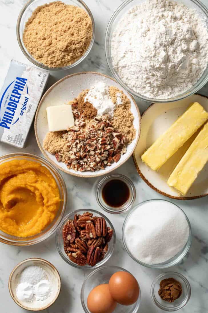 Pumpkin Cream Cheese Muffins Recipe Ingredients for Pumpkin Cream Cheese Muffins in bowls.