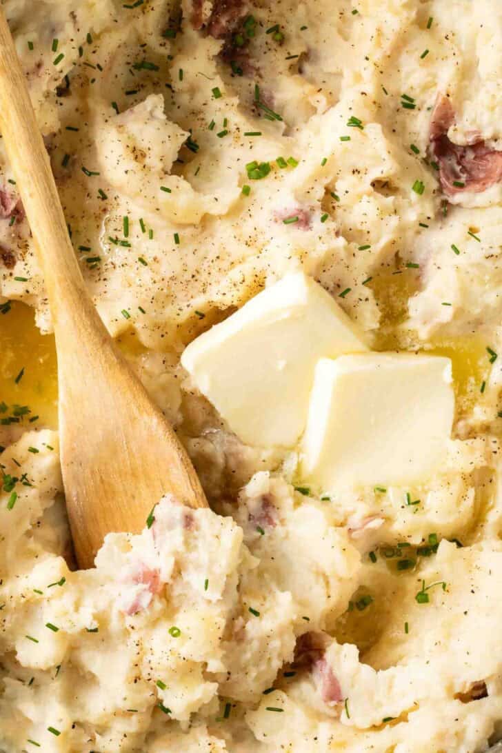 Red Skin Mashed Potatoes in a pot with butter.