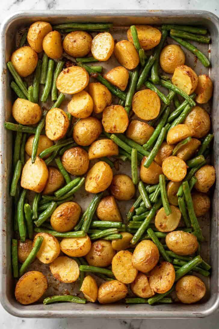 String Beans and Potatoes Roasted String Beans and Potatoes on a baking sheet.