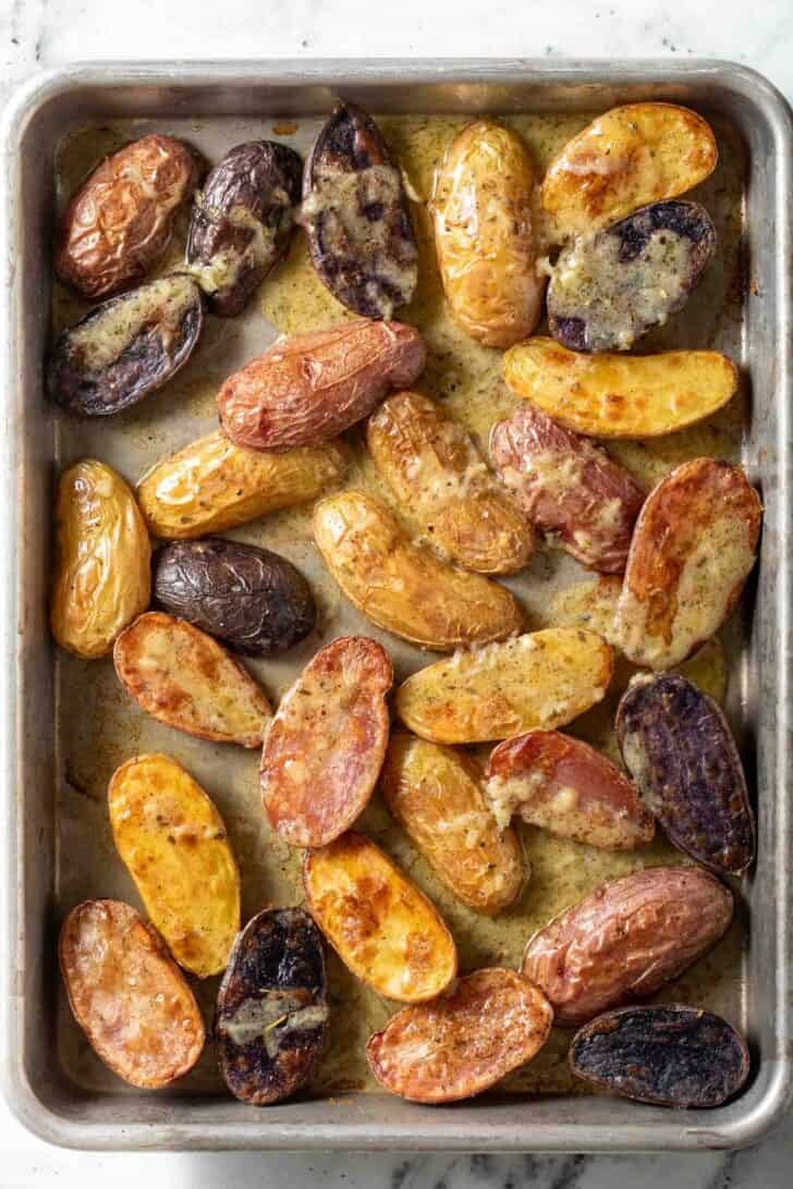 Roasted Fingerlings Roasted Fingerling Potatoes on a baking sheet.