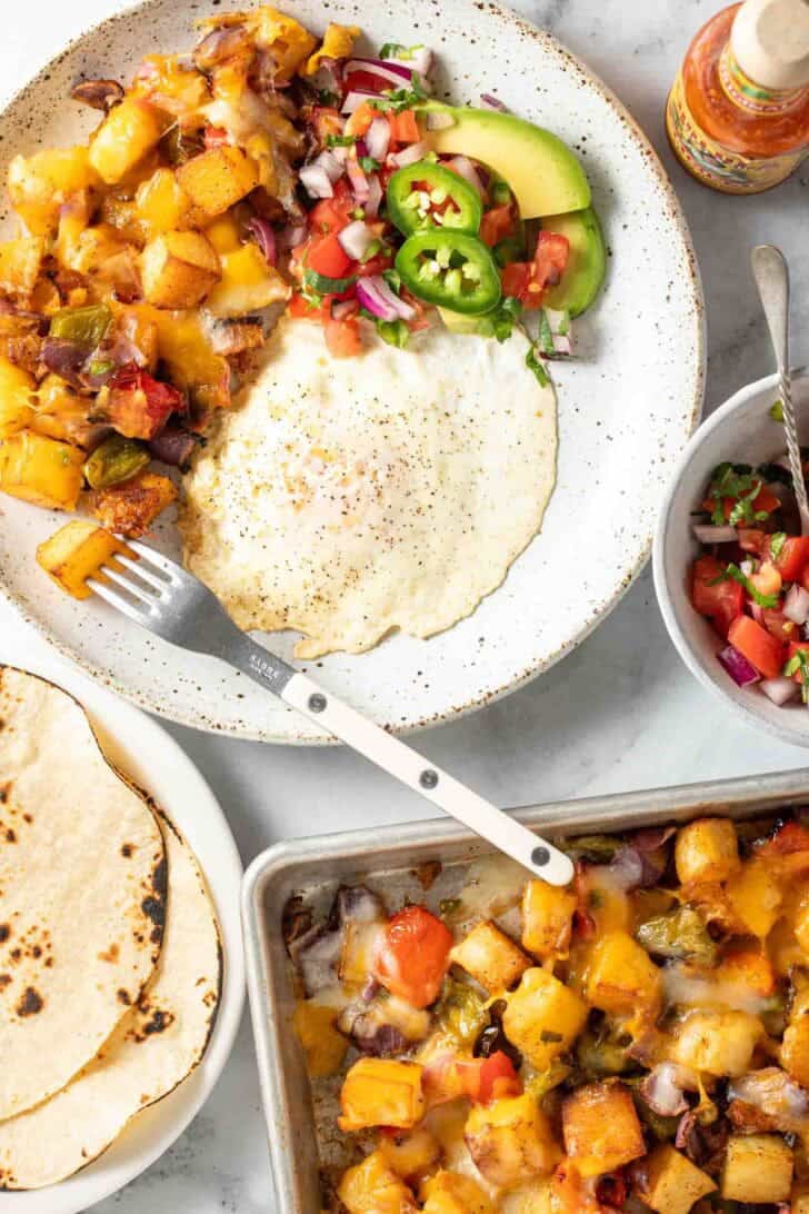 Mexican Breakfast Potatoes Mexican Breakfast Potatoes on a plate with a fried egg.