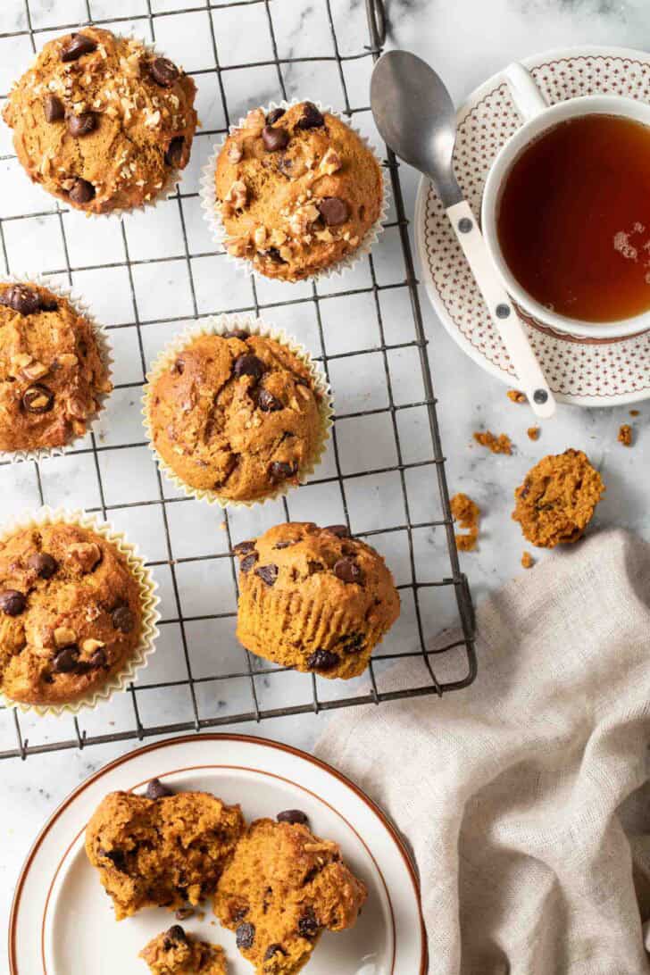 Pumpkin Muffins with Chocolate Chips Baked Pumpkin Muffins with Chocolate Chips on a cooling rack.