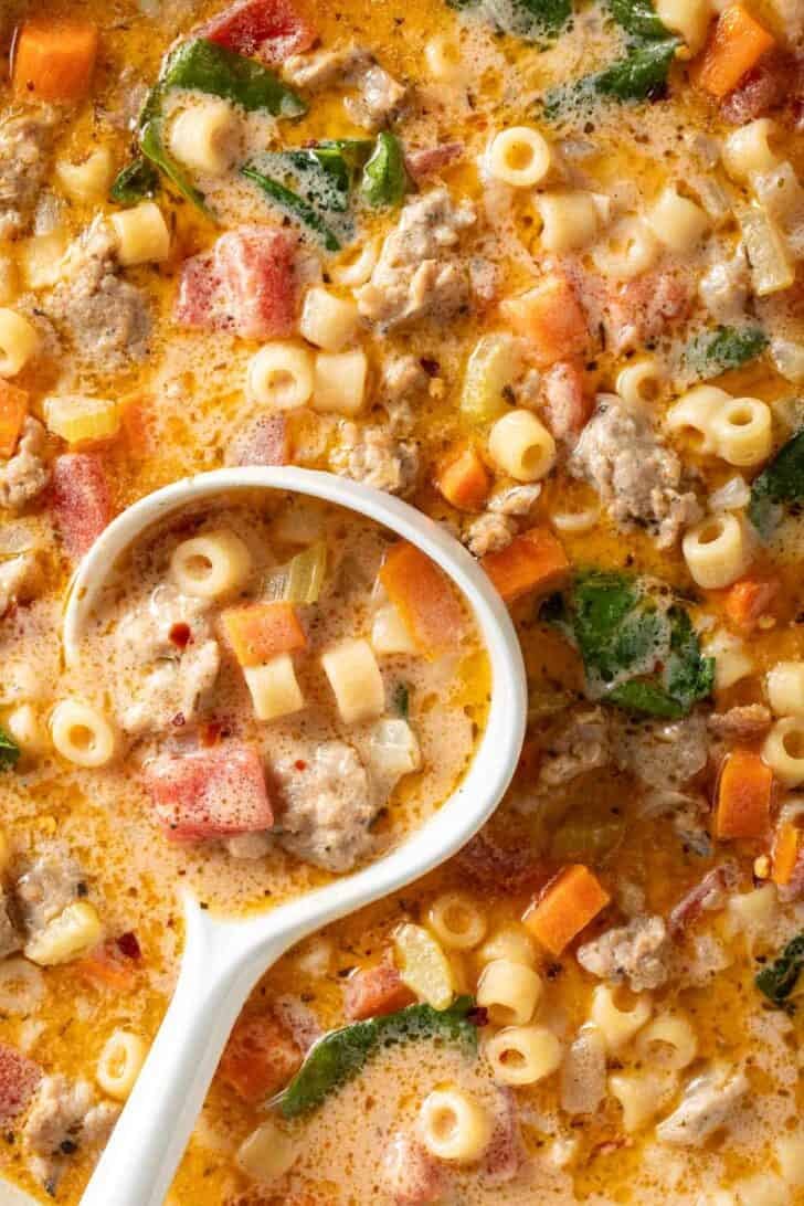 Creamy Parmesan Italian Sausage Ditalini Soup Creamy Parmesan Italian Sausage Ditalini Soup in a pot with a white ladle.