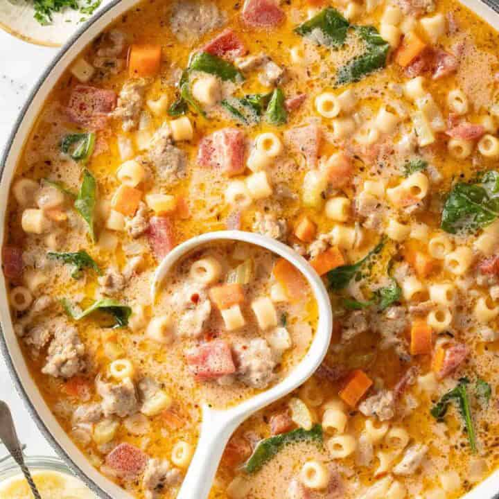 Creamy Parmesasn Italian Sausage Soup in a white pot.