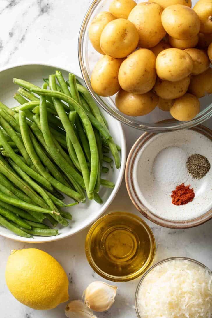Green Beans and Potatoes Recipe Ingredients for Roasted Green Beans and Potatoes recipe in glass bowls.