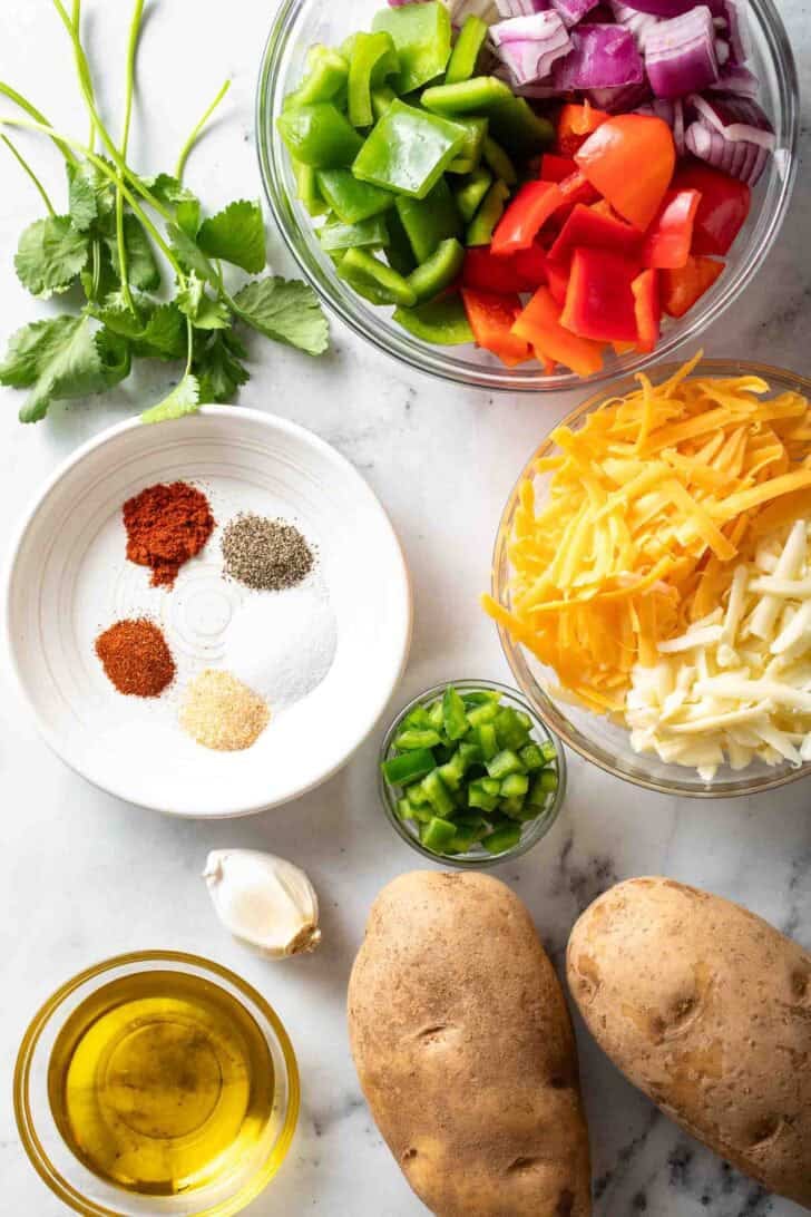 Mexican Roasted Potatoes Recipe Ingredients for Mexican Potatoes recipe in glass bowls.