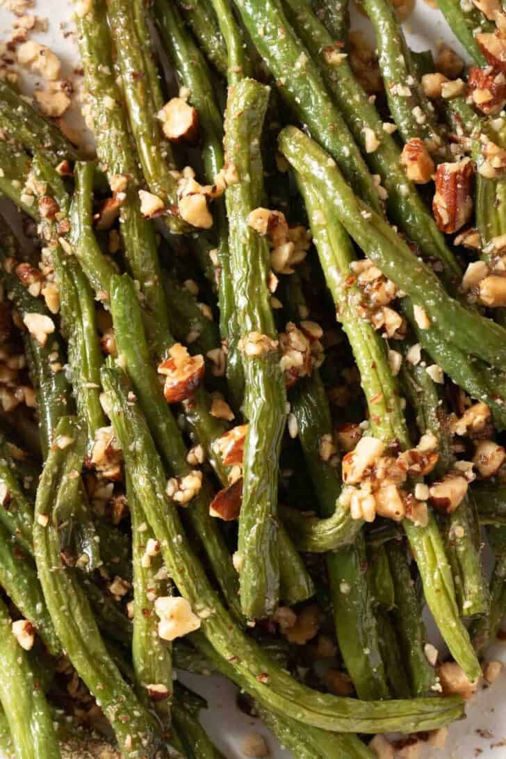 Oven Roasted Green Beans Recipe Oven Roasted Green Beans on a white plate.
